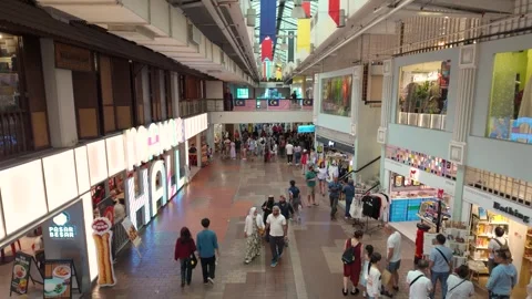 Visitors explore the spacious interior of Central Market Kuala Lumpur Stock Footage 340864017