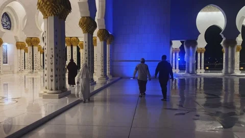 Visitors exploring beautiful Islamic architectural landmark at Sheikh Zayed Stock Footage 339765858