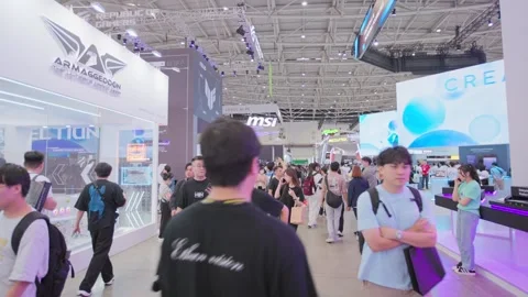 Visitors exploring Computex Taipei exhibition hall Stock Footage 335479269