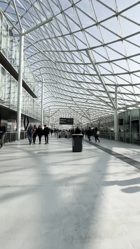 Visitors exploring Eicma, motorcylce trade show at Milano Rho Fiera Stock Footage 303567788