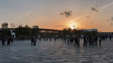Visitors Exploring Expo 2025 Osaka at Sunset Near the East Gate Stock Footage 321040282