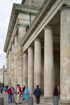 Visitors Exploring the Iconic Brandenburg Gate in Berlin, Germany Stock Photos