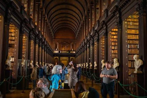 Visitors Exploring the Long Room at Trinity College Library Stock Photos