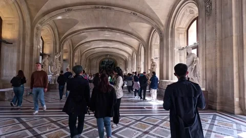 Visitors Exploring Louvre Museum Hallway Stock Footage 295615919