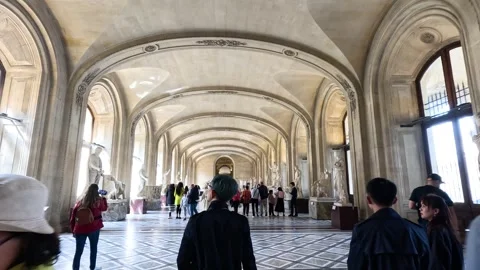 Visitors Exploring Louvre Museum Hallway Stock Footage 309514649