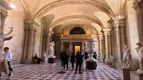 Visitors Exploring Louvre Museum Sculptures Stock Footage 298170352