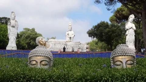 Visitors Exploring Reclining Buddha And Kuan Yin Statues at Eden Garden 스톡 동영상 337227389