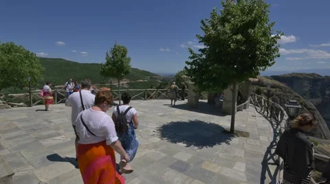 Visitors exploring the terrace of the Great Meteoron Monastery Stock Footage 67717984