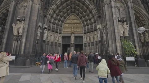 Visitors in front of Cologne Cathedral on a cloudy day Stock Footage 325088822