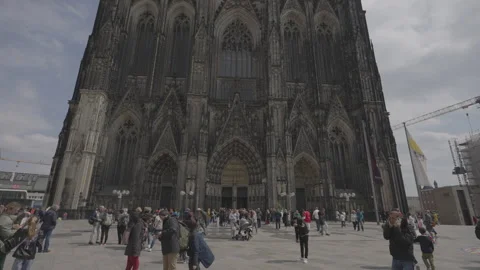 Visitors in front of Cologne Cathedral on a cloudy day Stock Footage 325103176