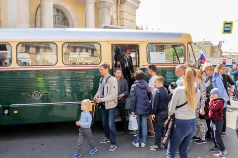 Visitors get off the bus. Stock Photos