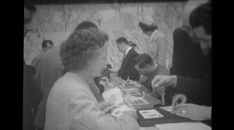Visitors getting envelopes stamped at Brussels World's Fair Stock Footage 37595046