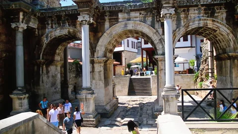 Visitors at Hadrian Gates during hot summer day. Stock Footage 152956868