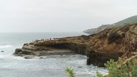 Visitors hike towards the tide pools at the Point Loma Ecological Reserve Stock Footage 113767357