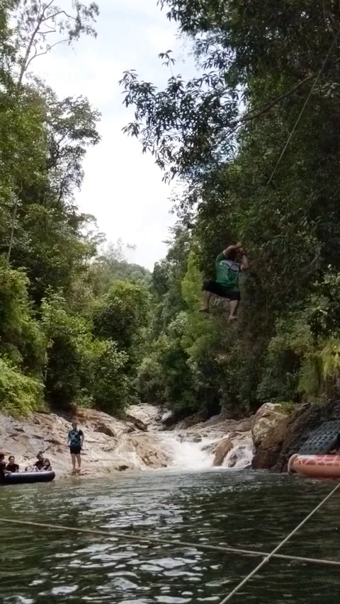 A visitors jumps into the lake. Stock Footage 230018096