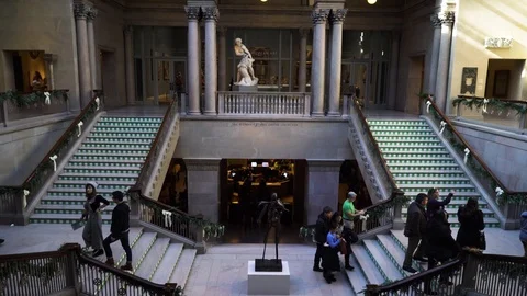 Visitors at the main hall with the stairs in the Chicago Art Institute Stock Footage