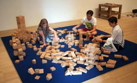 Visitors make interactive art in  a public building Stock Photos