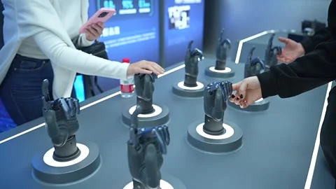 Visitors at a modern technology exhibition touching and testing futuristic Stock Footage 328988409