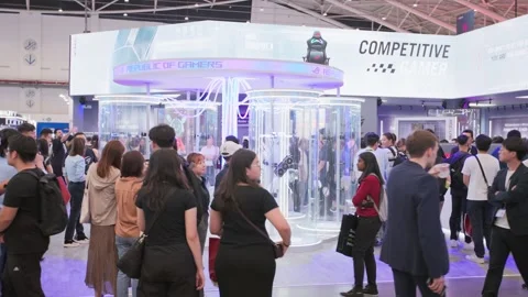 Visitors moving through Computex Taipei technology event Stock Footage 335479118