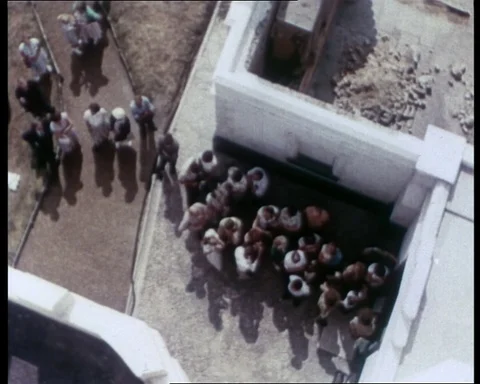 Visitors at the old lighthouse waiting to be let in, UK 1956 Stock Footage 133270174