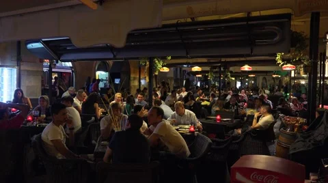 Visitors to the open-air cafes. Evening Prague. 4K. Video stock 53486530
