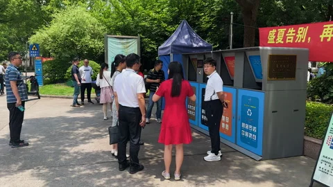 Visitors from other universities visiting garbage drop-off station Stock Footage 243971358