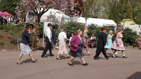 Visitors partaking in the 1940's tea dance Stock Footage 71573523