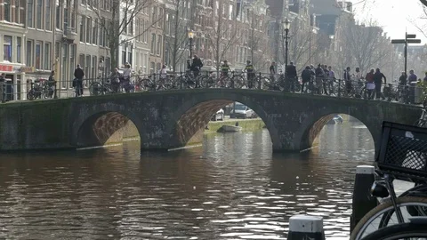 Visitors passing over canal bridge within the Red Light District Stock Footage 74172893