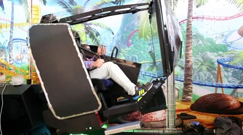 Visitors playing on redemption video simulator game Stock Footage 52084480