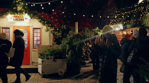 Visitors Pose for Photo at Old Riga Christmas Market Festive Winter Evening Stock Footage 341845678