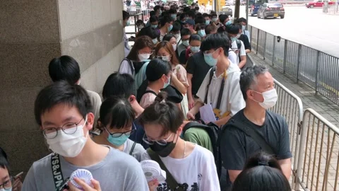 Visitors queue in line to attend the Ani... | Stock Video | Pond5