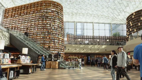 Visitors at the reading area of Starfield Library in Seoul Stock Footage 85714377