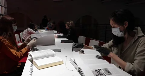 Visitors reading at a table in the museum library Stock-Footage 135603118