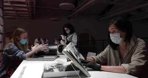 Visitors reading at a table in the museum library Stock-Footage 135603229