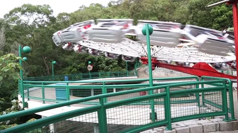 Visitors ride on the carousel in the Ocean Park in Hong Kong Stock Footage 50542292