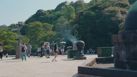 Visitors Sightseeing Around Kamakura Daibutsu at Kotoku-in Temple Stock Footage 346104461