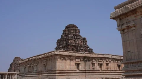 Visitors at Stone Columns and Structure at a Hindu Temple in Hampi Vídeos de archivo 348266759