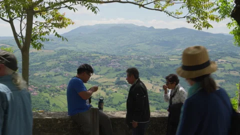 Visitors at a Stone Viewpoint Overlooking the San Marino Countryside 库存影片 341684211