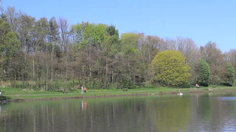 Visitors stroll at Moses Gate Country Park nature reserve, Bolton Video stock 42575014