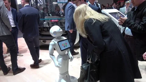 Visitors talking with humanoid robot on exhibition Cebit 2017 in Hannover Messe Stock Footage 74364607