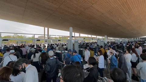 Visitors Undergo Security Checks at the Entrance of Expo 2025 Osaka Stock Footage 320998718
