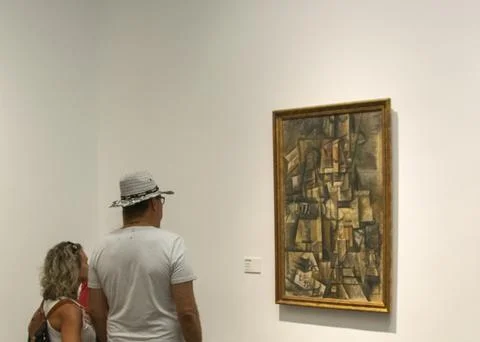 Visitors viewing artwork inside a Prado Madrid museum Stock Photos