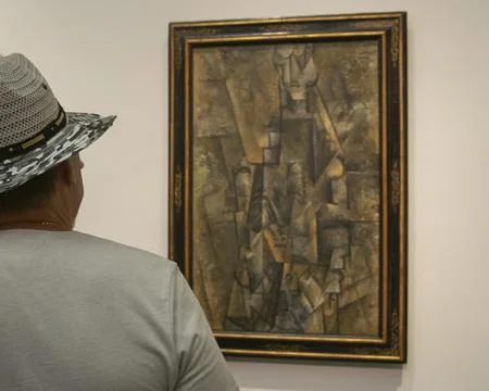 Visitors viewing artwork inside a Prado Madrid museum Stock Photos