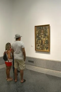 Visitors viewing artwork inside a Prado Madrid museum Stock Photos