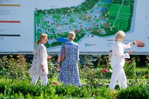 Visitors Viewing VDNH Information Map in Kyiv Stock Photos