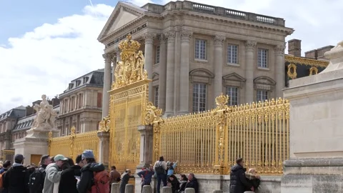 Visitors wait in line in front of golden gates at Versailles Palace Video stock 271111043