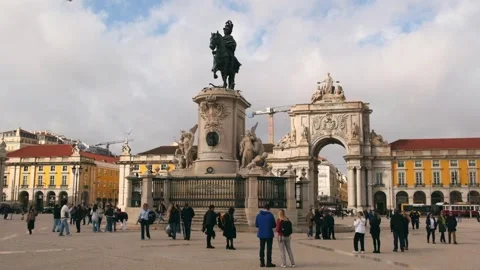 Visitors walk across Commerce Square in Lisbon Stock Footage 338174150