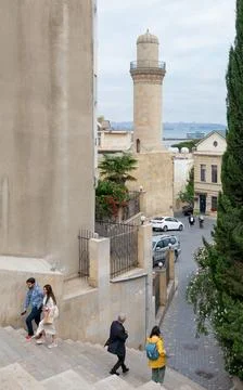 Visitors walk down the stairs in the Old City, Baku, Azerbaijan, with the Stock Photos