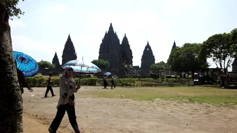 Visitors walking in front of Prambanan Temple Stock Footage 152225954