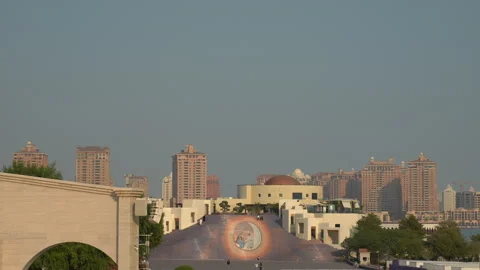 Visitors walking on Katara Mosaic Stairs and open courtyard near Boho Social. Stock Footage 345807961